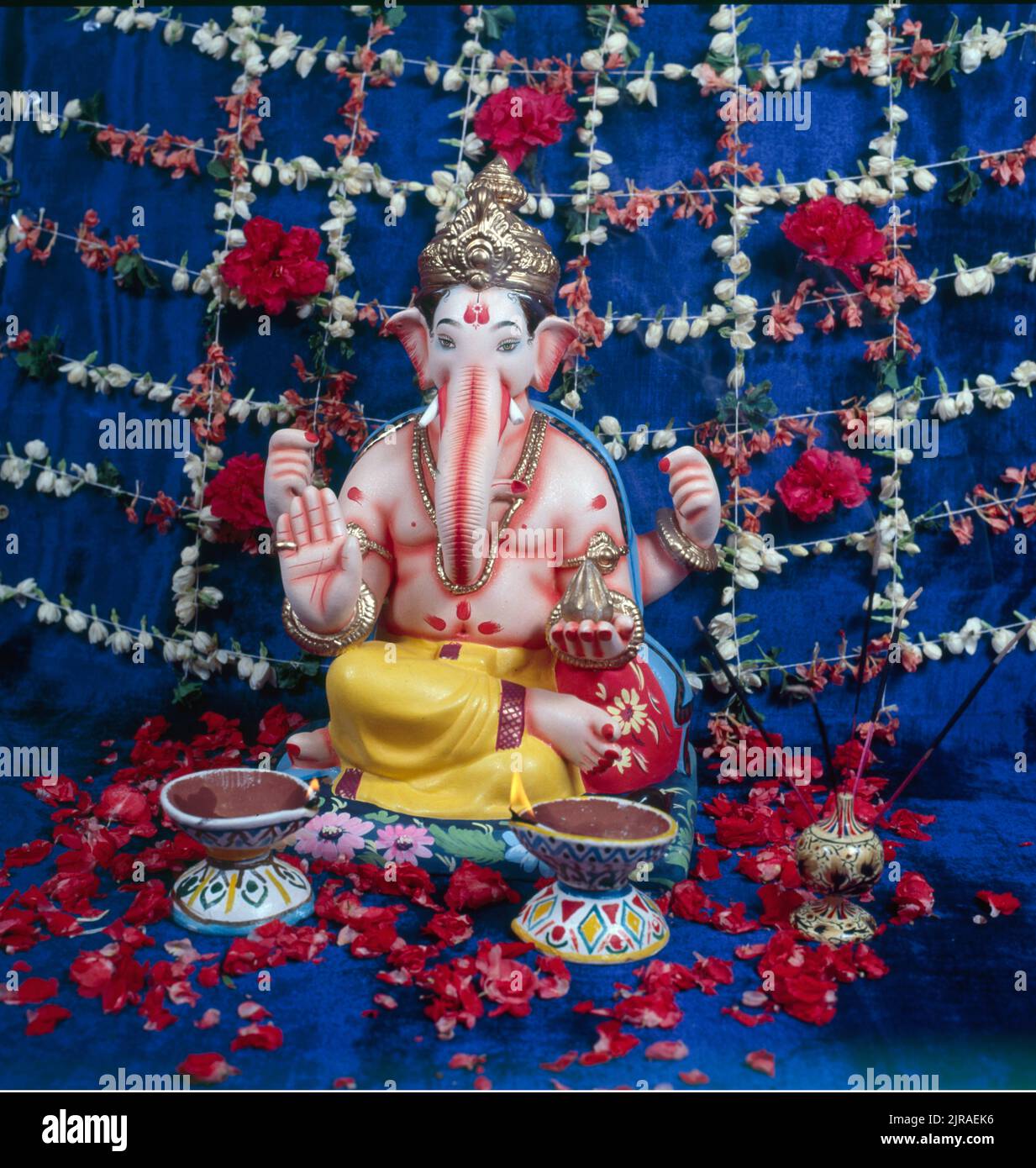 Lord Ganesh with decoration and lamps Stock Photo - Alamy