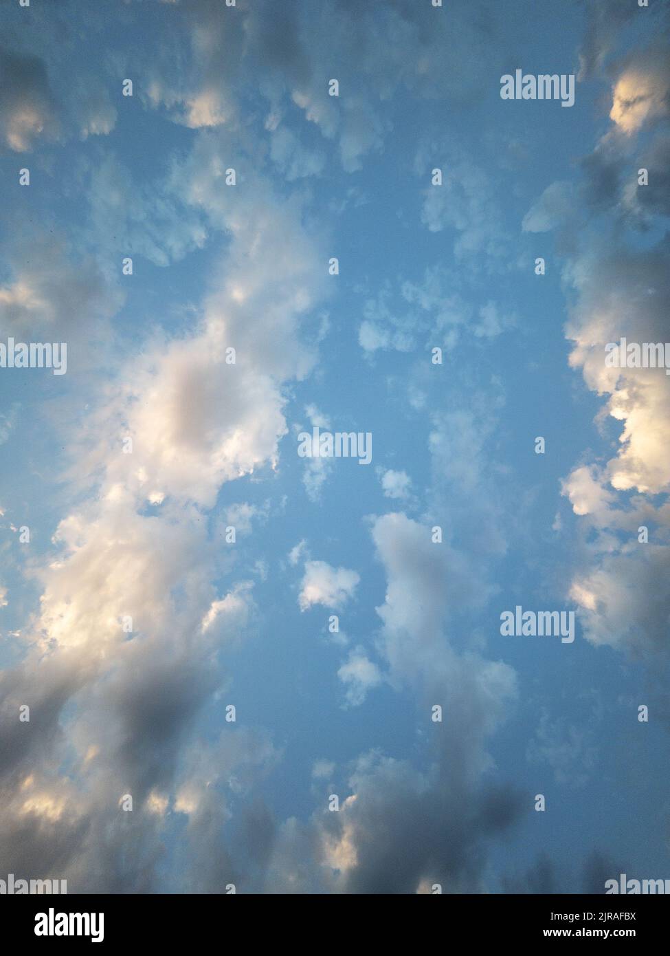 Evening sunset blue sky with clouds full screen Stock Photo - Alamy