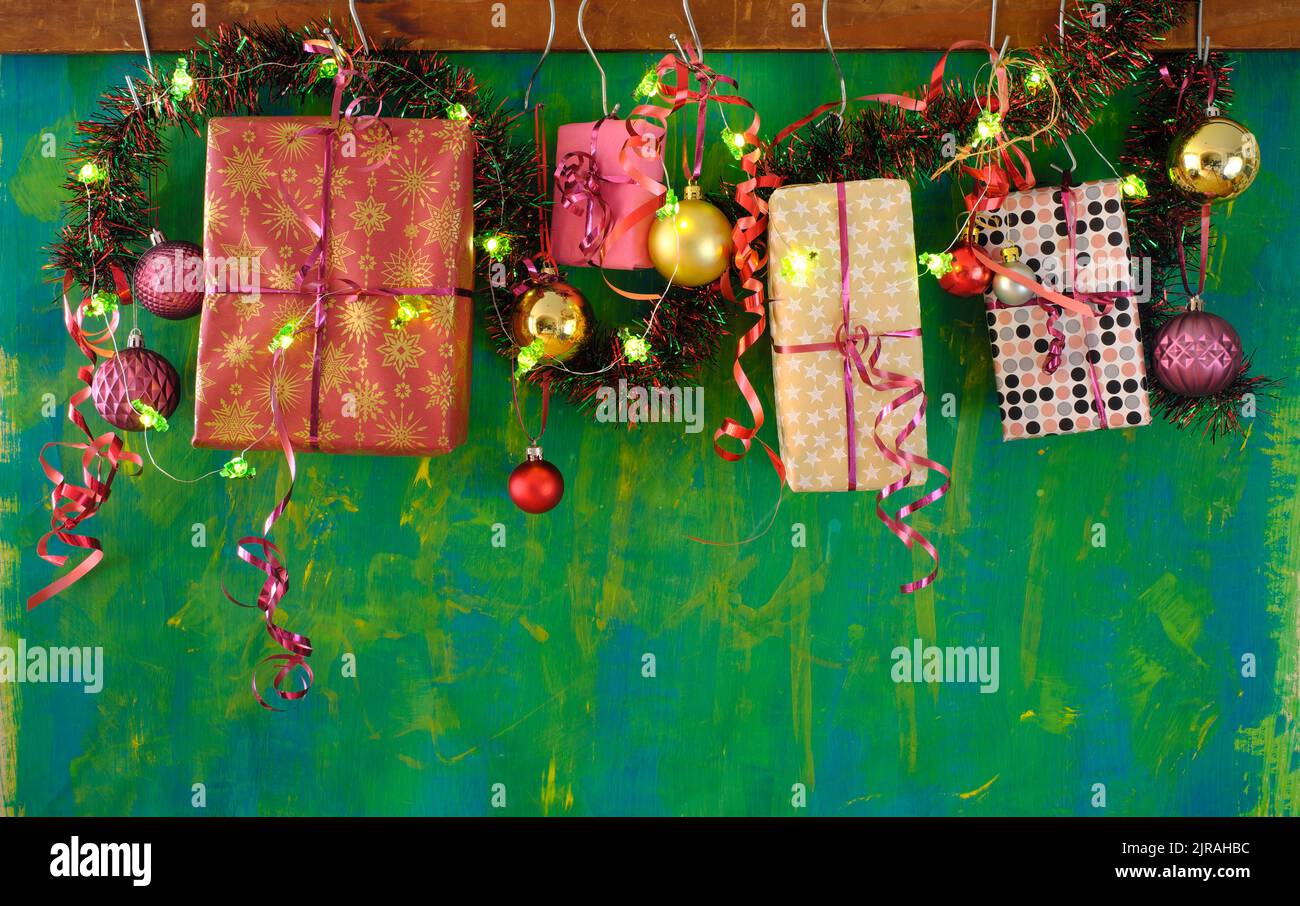 Hanging Christmas gifts and christmas decoration, christmas balls, lights, free copy space Stock Photo