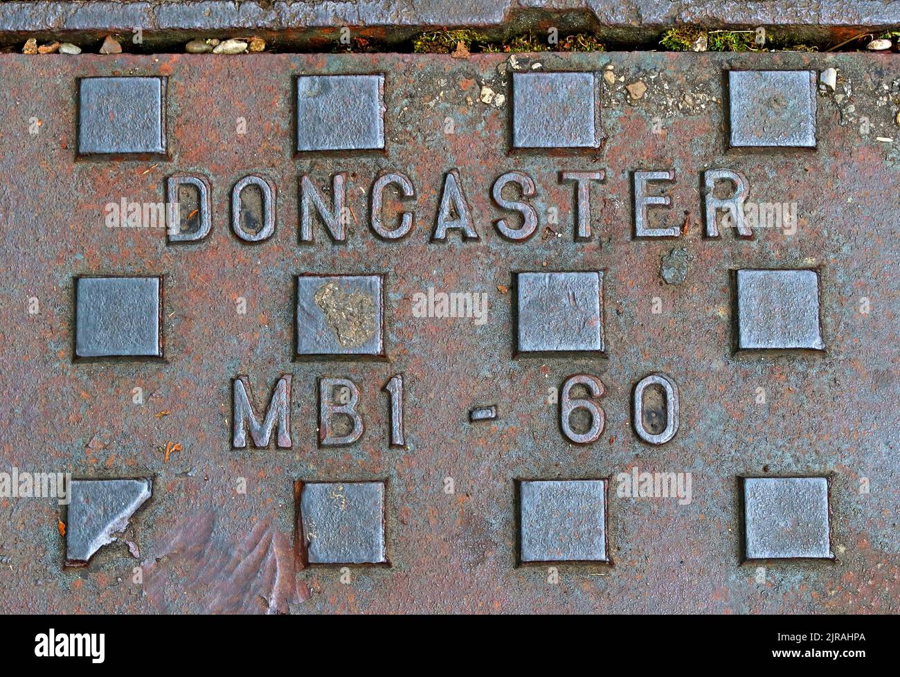 Doncaster, embossed cast iron grid, Yorkshire, England, UK, DN1 1AB Stock Photo
