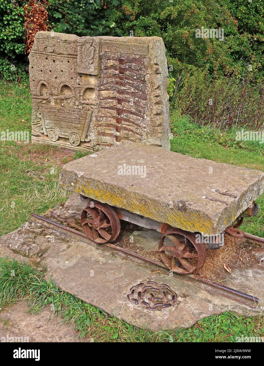 Art work from stone and cast iron mine working waggon and rails, Vale of Llangollen, Trevor, Llangollen, Wales, UK,  LL20 7TP Stock Photo