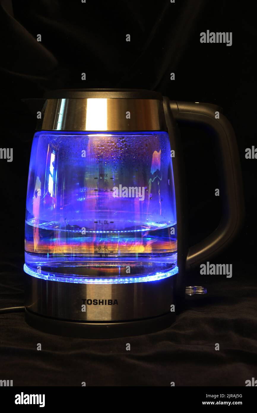 An Electic Kettle on kitchen work surface with wather being boiledThe