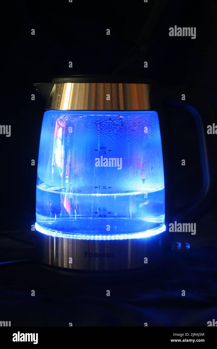 An Electic Kettle on kitchen work surface with wather being boiledThe