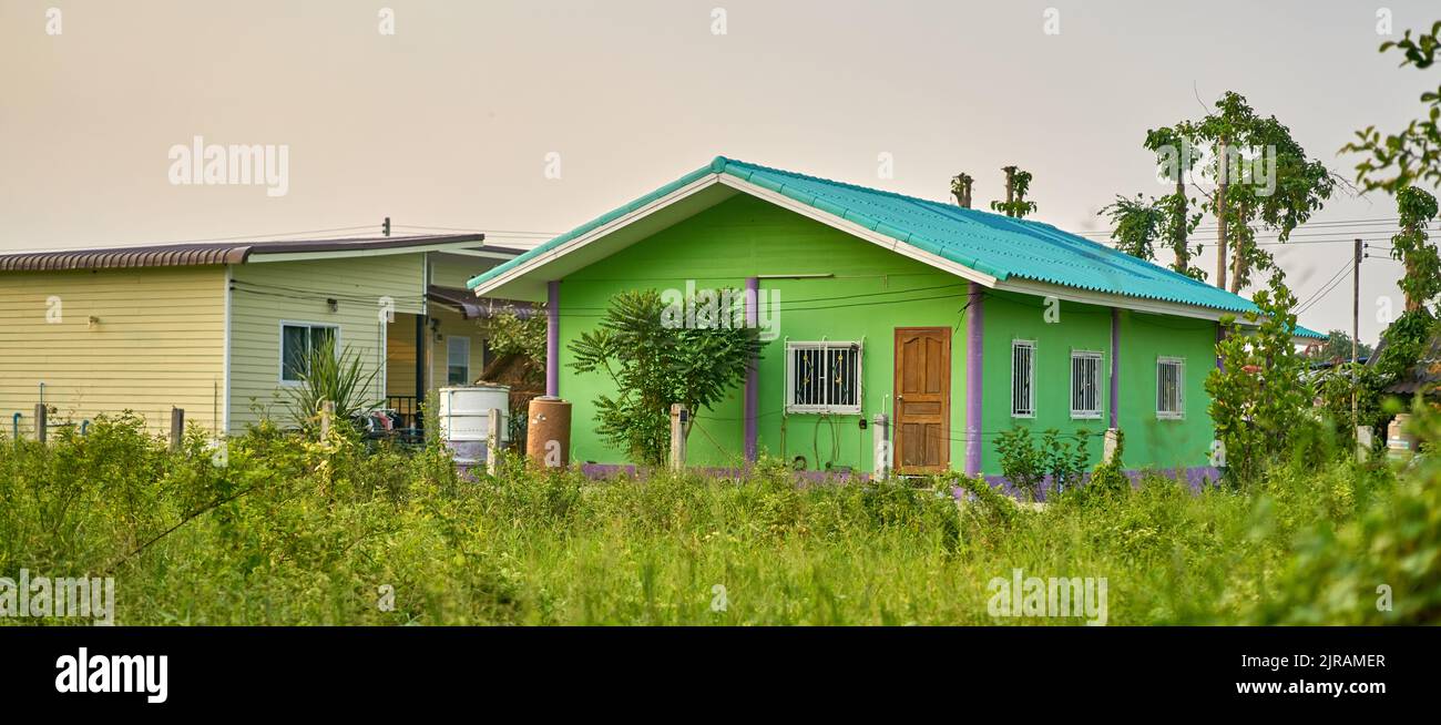 A small simple house in a green landscape. Stock Photo