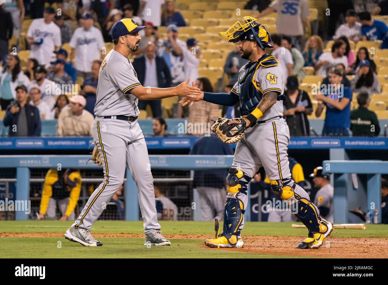 Milwaukee Brewers starting pitcher Jason Alexander (41) and catcher Omar Narvaez (10) celebrate a victory during a MLB game against the Los Angeles Do Stock Photo