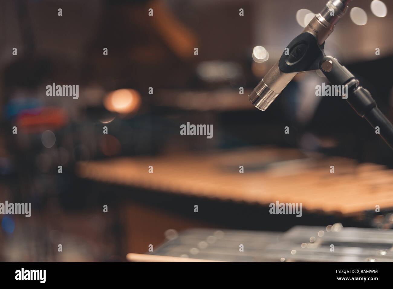 A selective focus of a studio microphone with a stand in the blurred ...