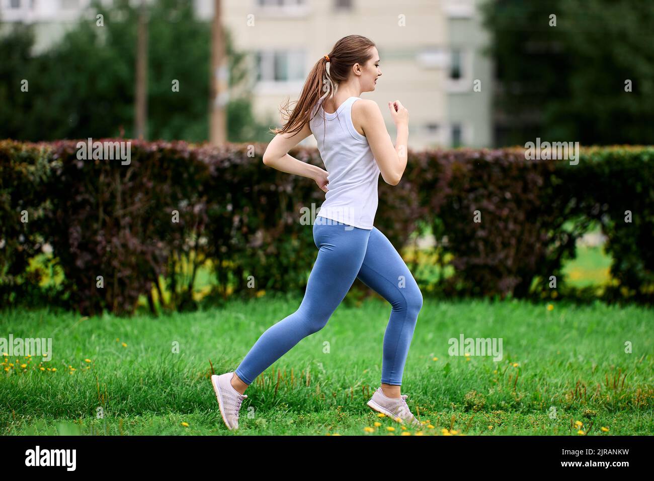 White female runner in residential hi-res stock photography and images ...