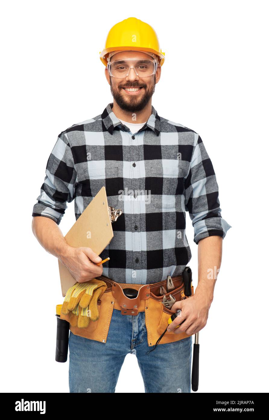 male worker or builder in helmet with clipboard Stock Photo