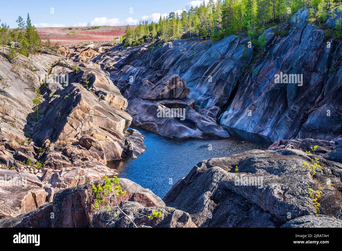 Sweden, Norrbotten County, Porjus, Rocky valley and small lake in Muddus National Park Stock Photo