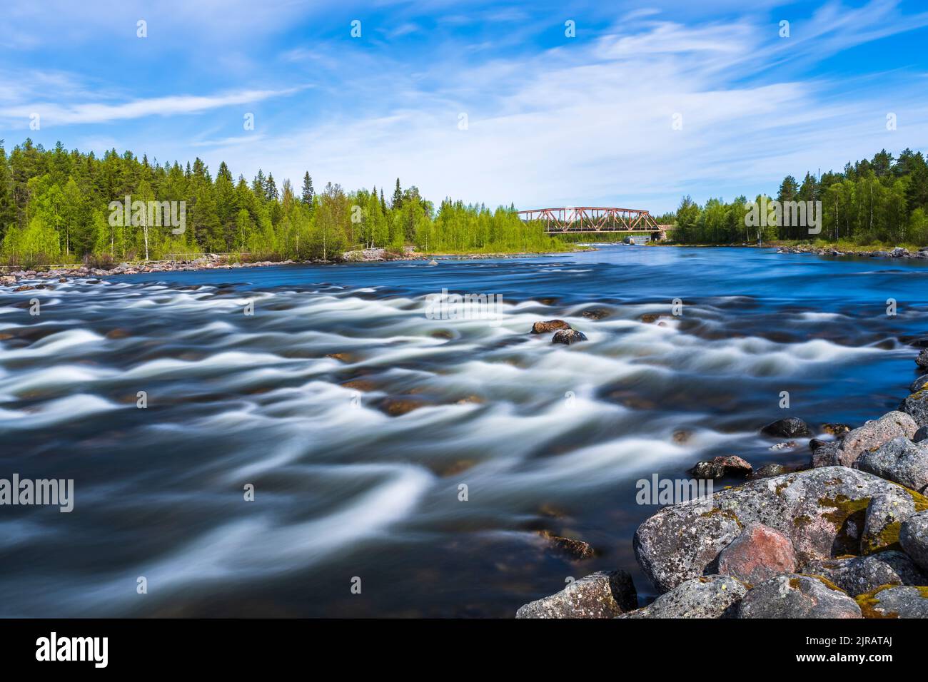 Sweden, Norrbotten County, Long exposure of river Slagnas in summer Stock Photo