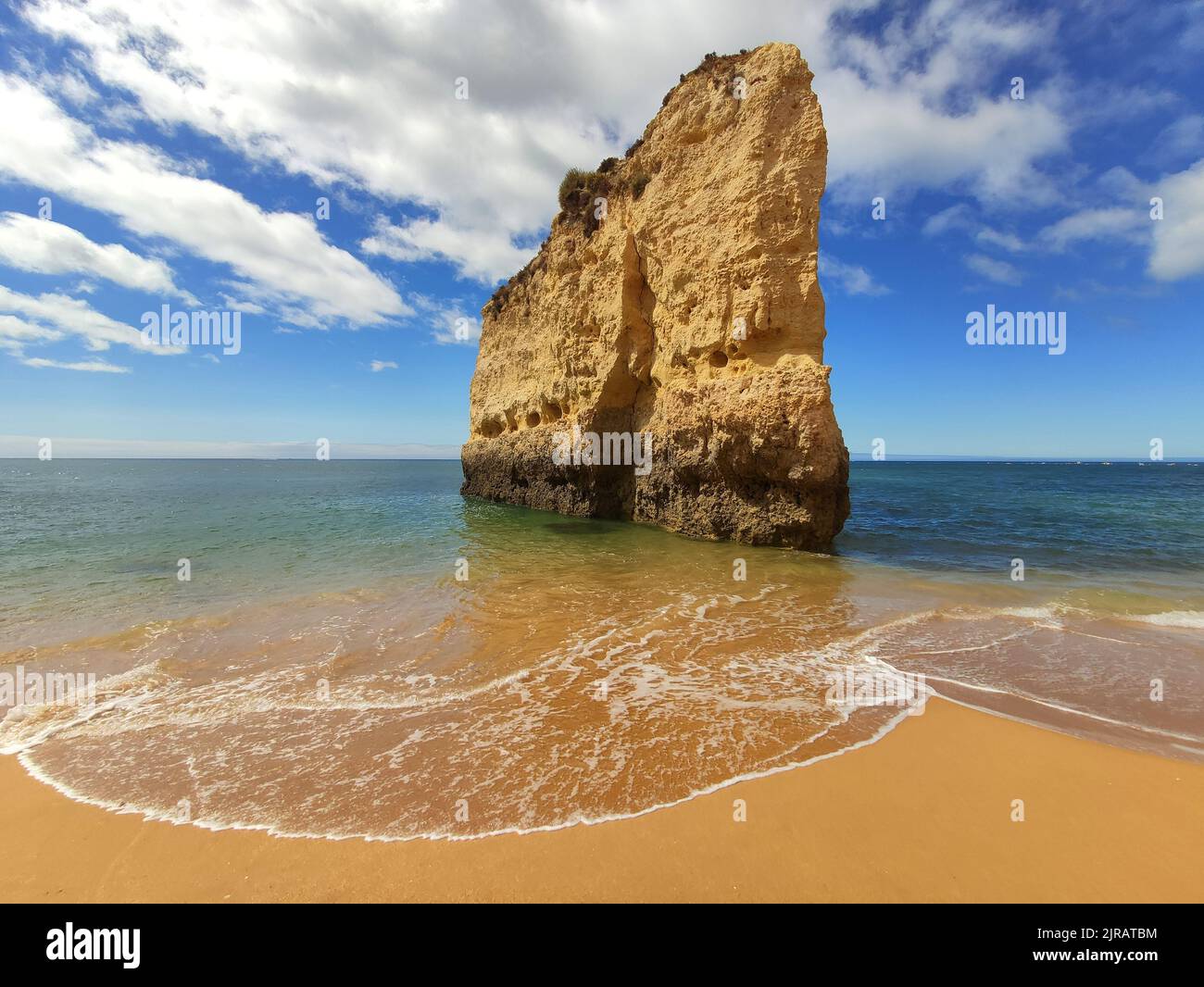 Algarve beach cliff rock in Portugal. Scenic Atlantic Ocean view. Stock Photo
