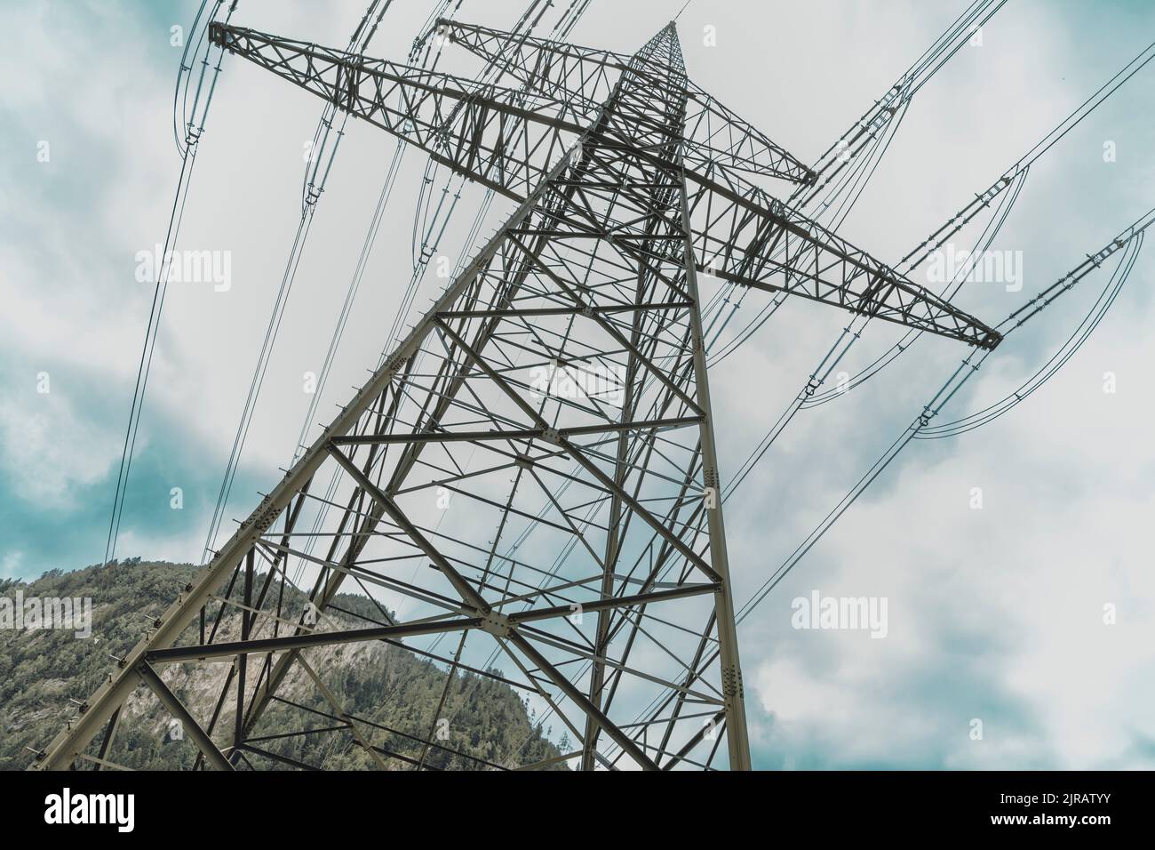 High voltage electricity tower in front of sky Stock Photo - Alamy