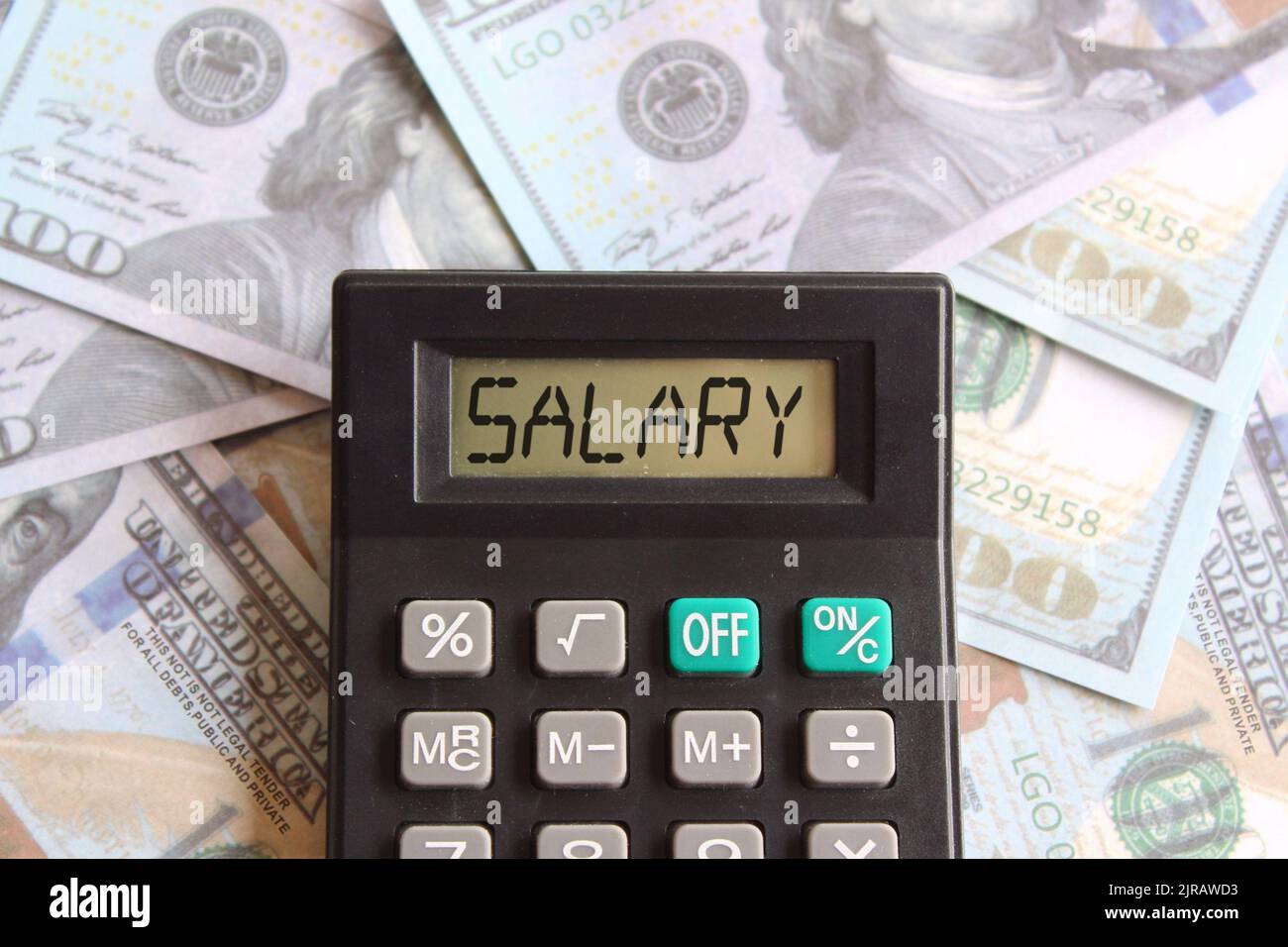 Top view image of calculator with text SALARY and money. Business and finance concept Stock Photo