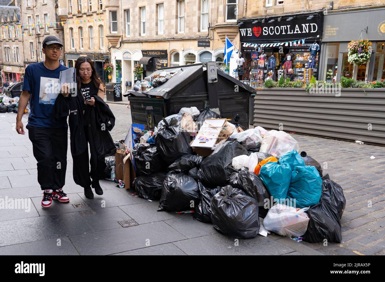 Edinburgh, Scotland, UK. 23rd  August 2022. Rubbish is seen piled on the streets of Edinburgh city centre on day six of a 12 day strike by city refuse collectors. Pic; Overflowing bins in the Old Town.  Iain Masterton/Alamy Live News Stock Photo