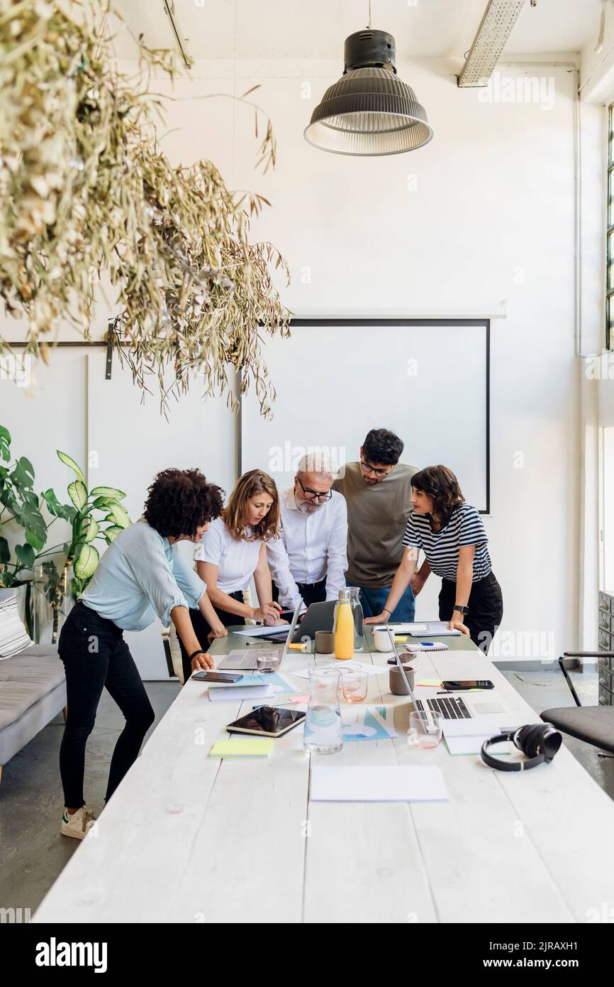Multiracial business colleagues working together at office Stock Photo ...