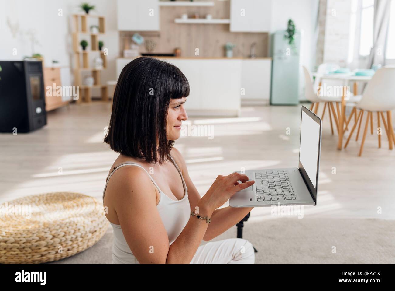 Freelancer using laptop at home Stock Photo