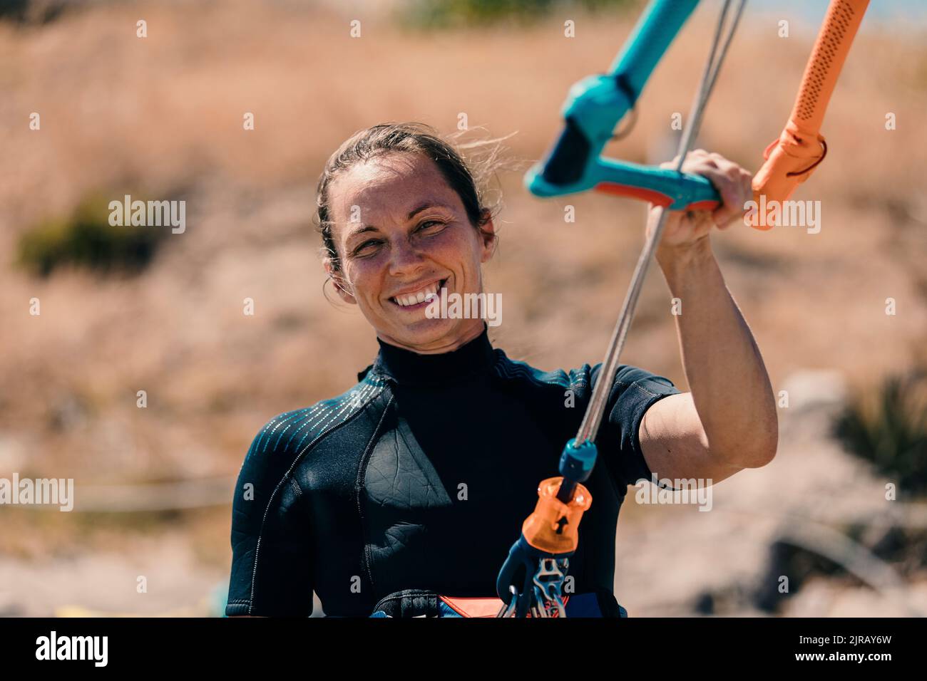 Woman kite surfing kite beach hi-res stock photography and images - Alamy