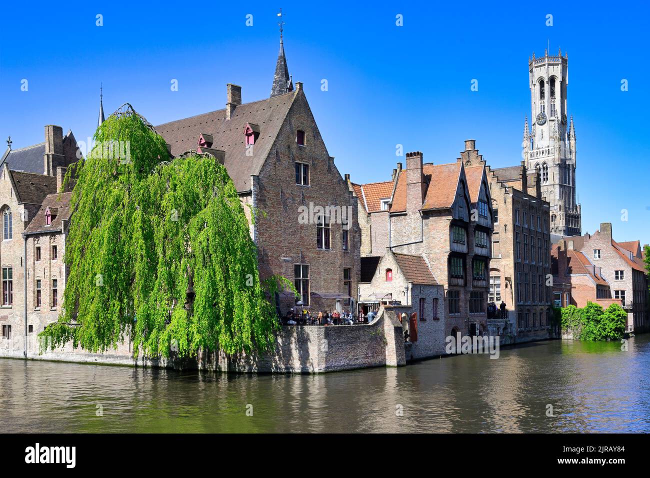 Famous canal of Rozenhoedkaai and the Belfry in the background, Bruges, Belgium Stock Photo