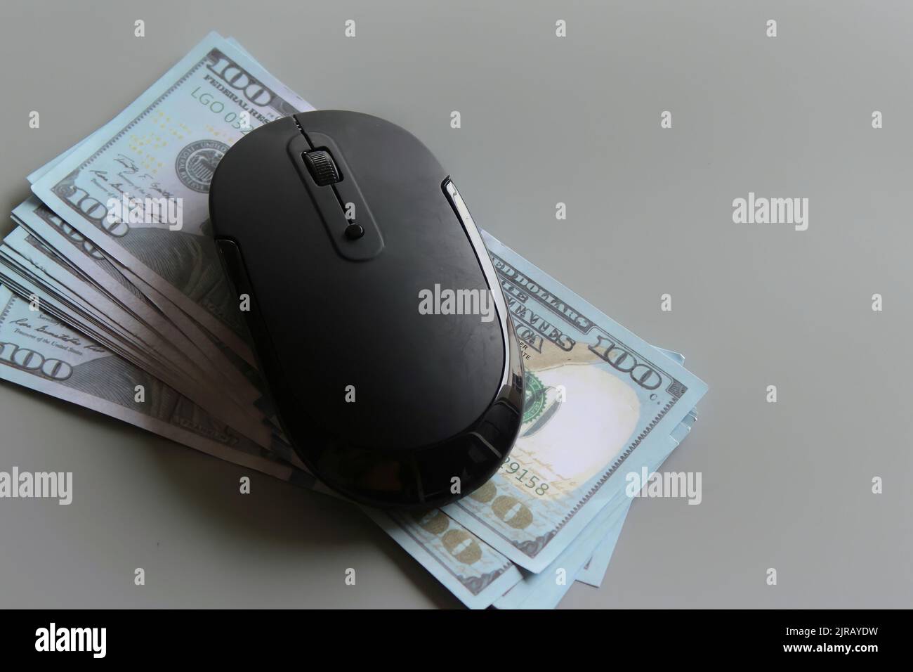 US dollar and computer mouse. Pay per click, online banking, shopping and business concept Stock Photo