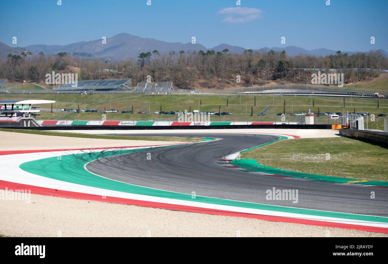 Black asphalt racetrack double turn with curbs empty motor sport background. Mugello, Italy, march 25 2022. 24 Hours series Stock Photo