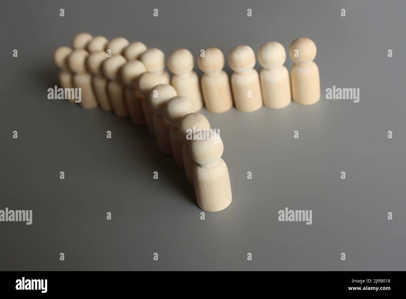 Reorganization of the company, dividing team concept. Group of people figures divide into two. Stock Photo