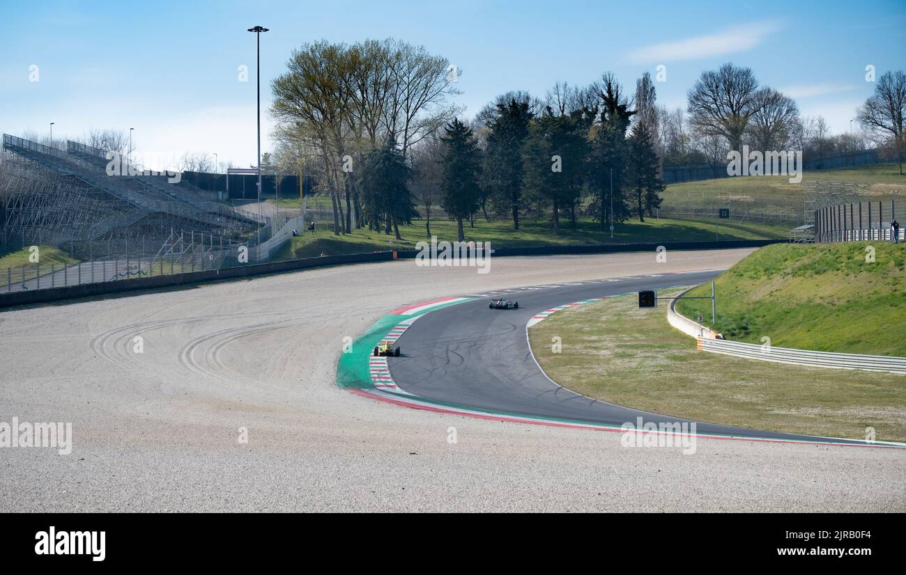 Asphalt racetrack turn and curbs with formula cars racing motor sport. Mugello, Italy, march 25 2022. 24 Hours series Stock Photo