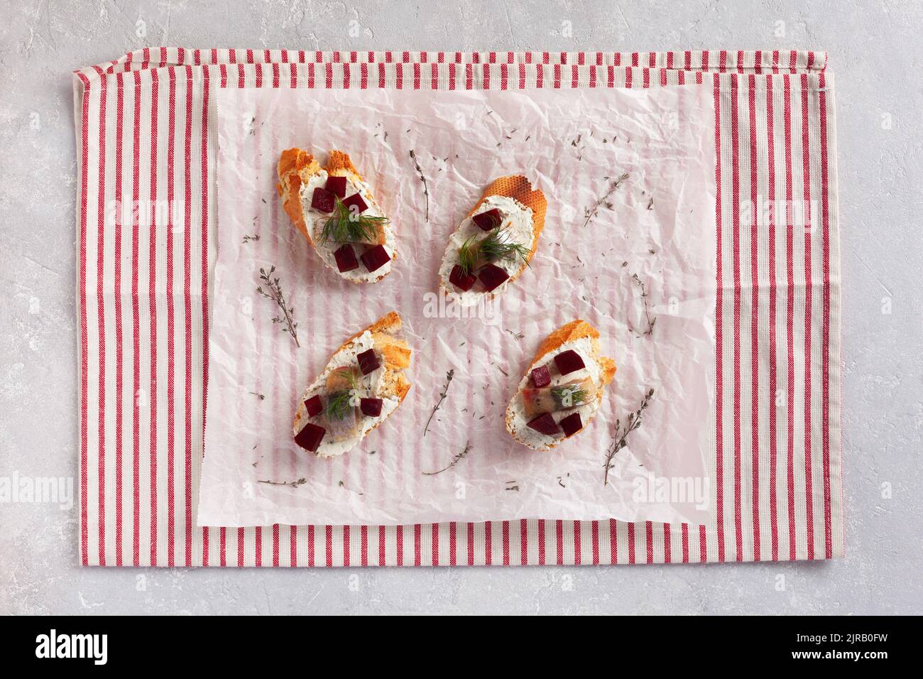 smoked hering, beet root and soft cheese toasts, top view Stock Photo ...