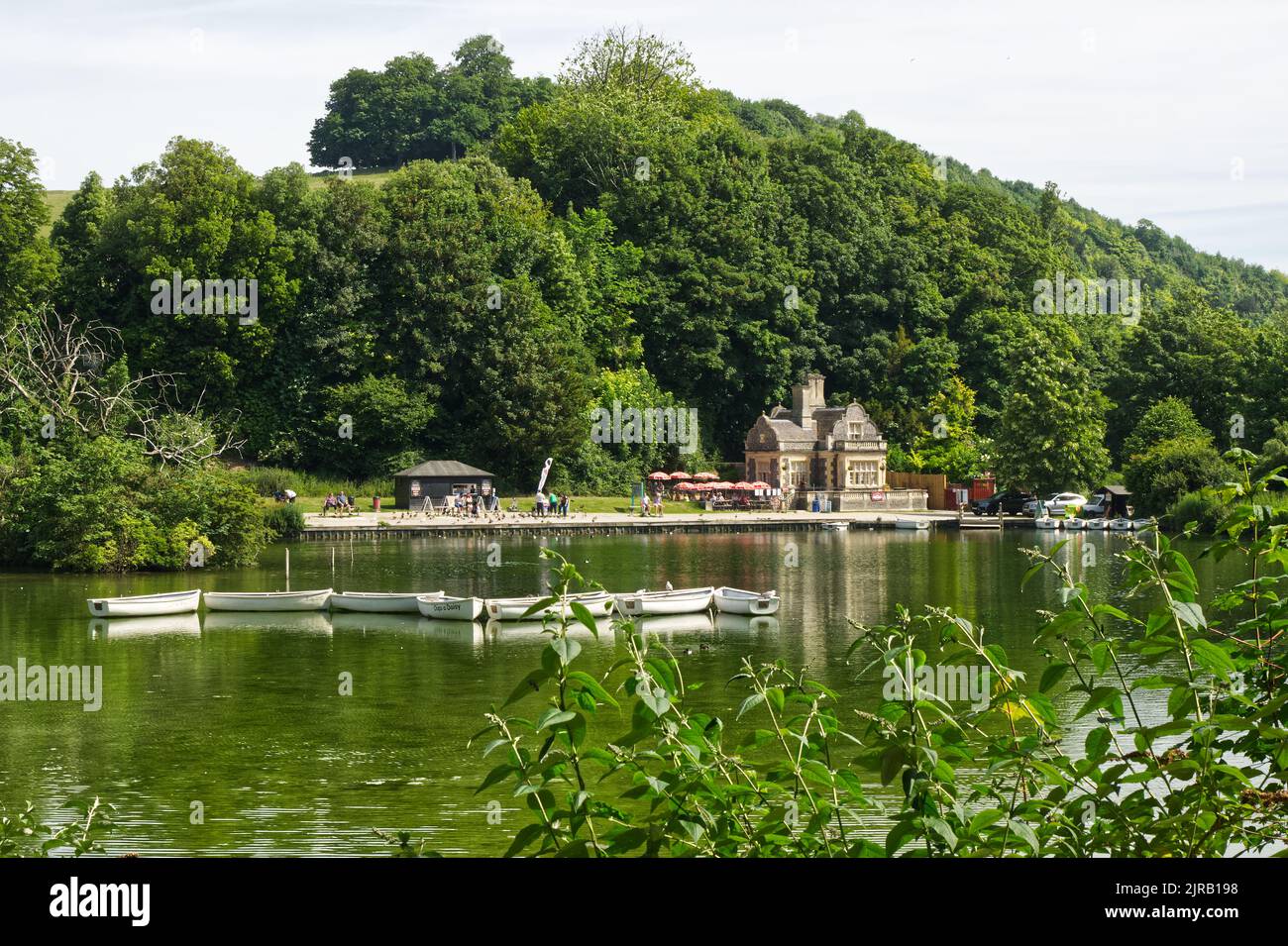 Swanbourne Lake at Arundel in West Sussex, England. With hire boats, cafe and people. Stock Photo