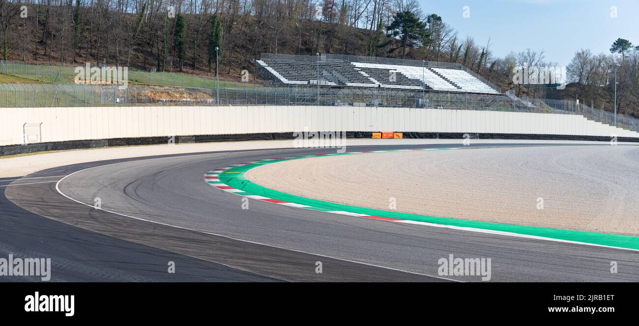 Black asphalt racetrack turn with curbs empty motor sport background. Mugello, Italy, march 25 2022. 24 Hours series Stock Photo