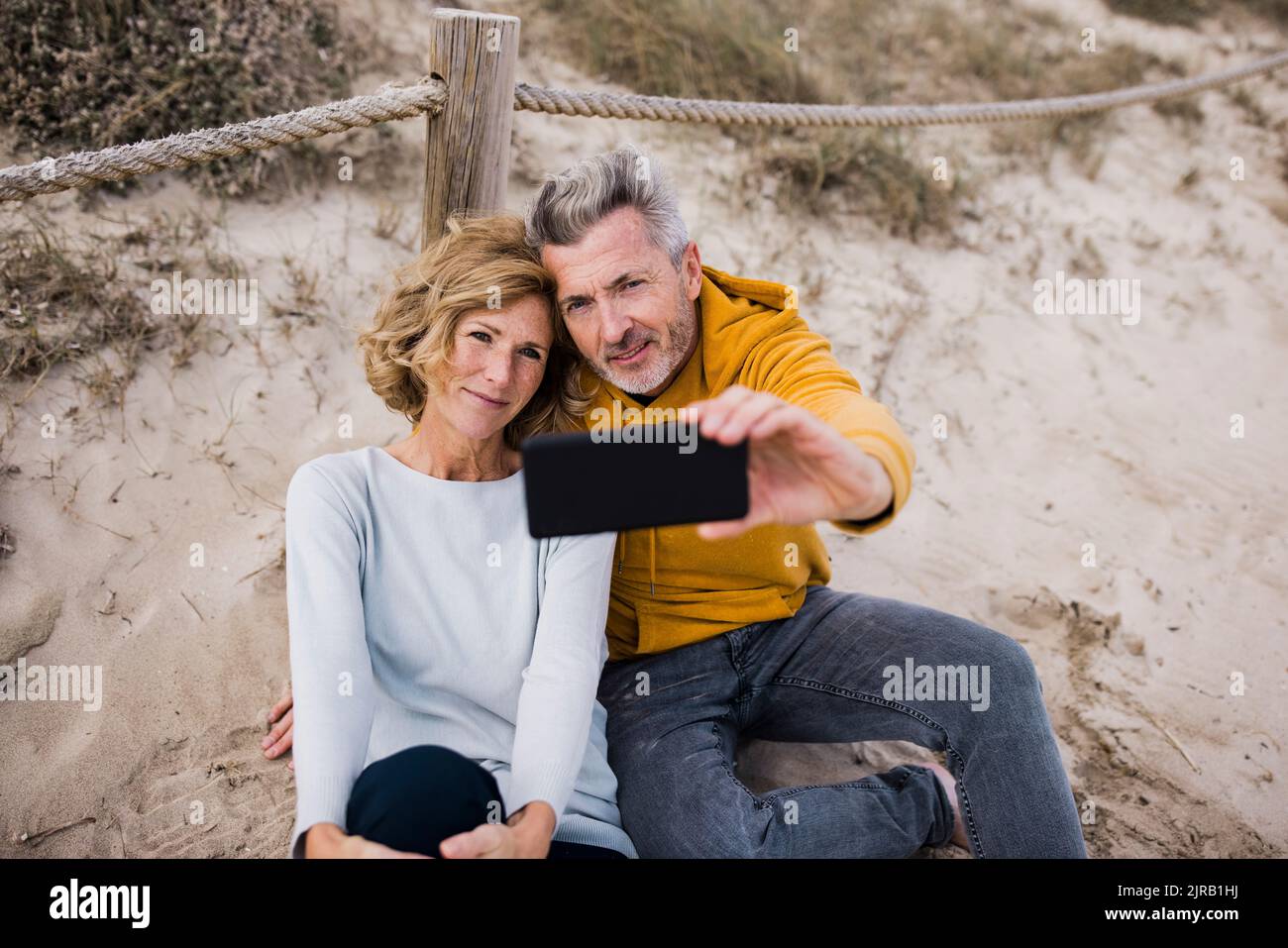 Mature couple taking selfie through smart phone Stock Photo