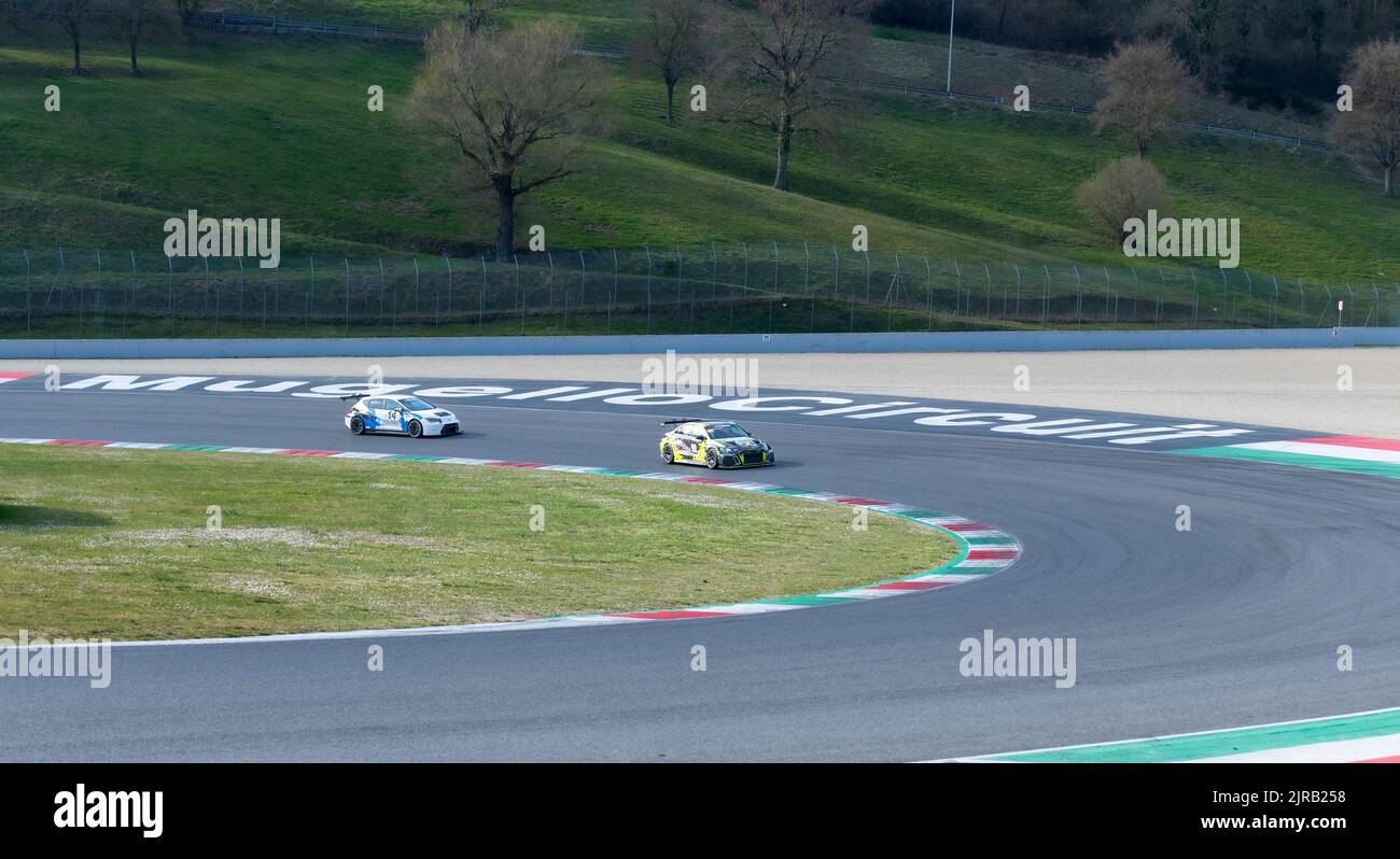 Racing touring cars on racetrack turn in Mugello circuit. Mugello, Italy, march 25 2022. 24 Hours series Stock Photo