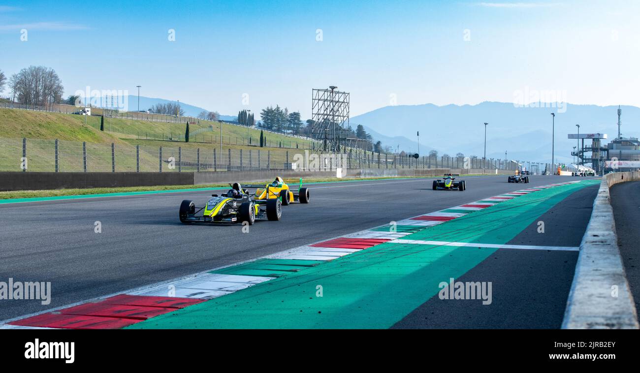 Formula race car single seater action on racetrack scenic mountains background. Mugello, Italy, march 25 2022. 24 Hours series Stock Photo
