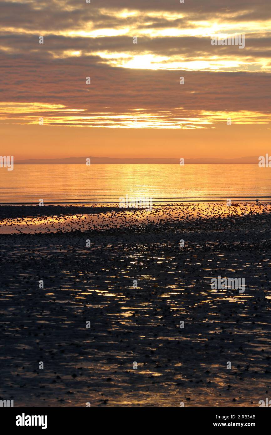 Prestwick, Ayrshire, Scotland, UK. The sun sets of the Firth of Clyde