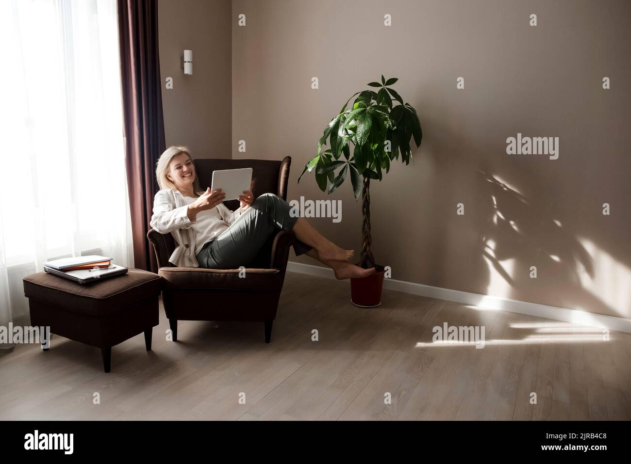 Happy woman home watching movie hi-res stock photography and images - Alamy