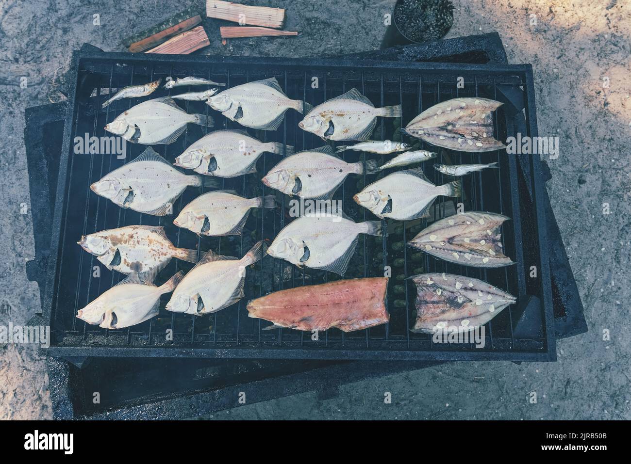 Fish Smoking Process. Smoked flounder. Close Up Smoking. View from above, soft focus Stock Photo