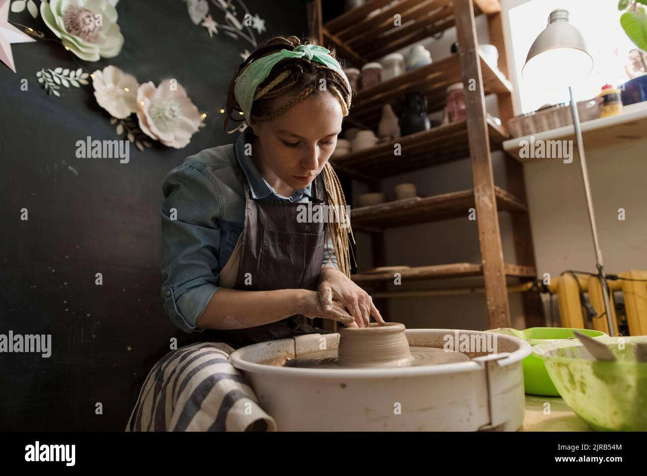 Craftsperson working at workshop Stock Photo