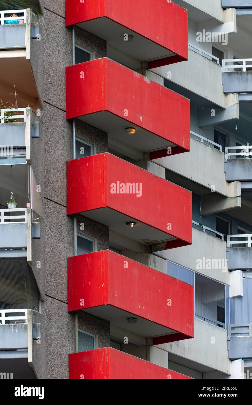 Germany, North Rhine-Westphalia, Cologne, Row of red painted apartment balconies Stock Photo