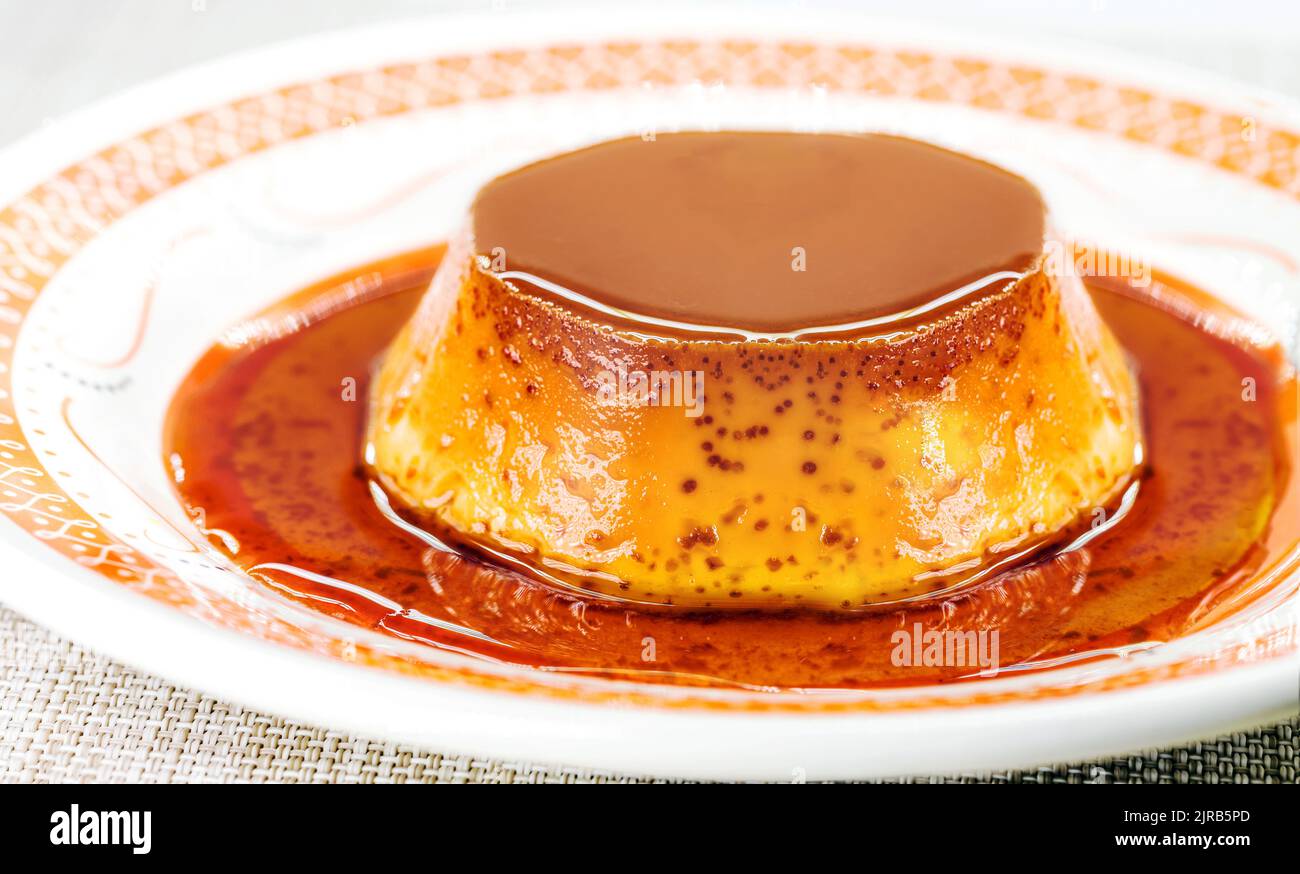 Brazilian condensed milk pudding, with vanilla syrup Stock Photo Alamy