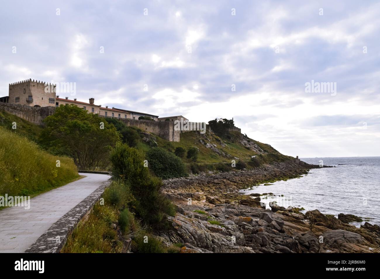 View of the fortress walls and Parador Monterreal on the hill. Bayona- Spain Stock Photo