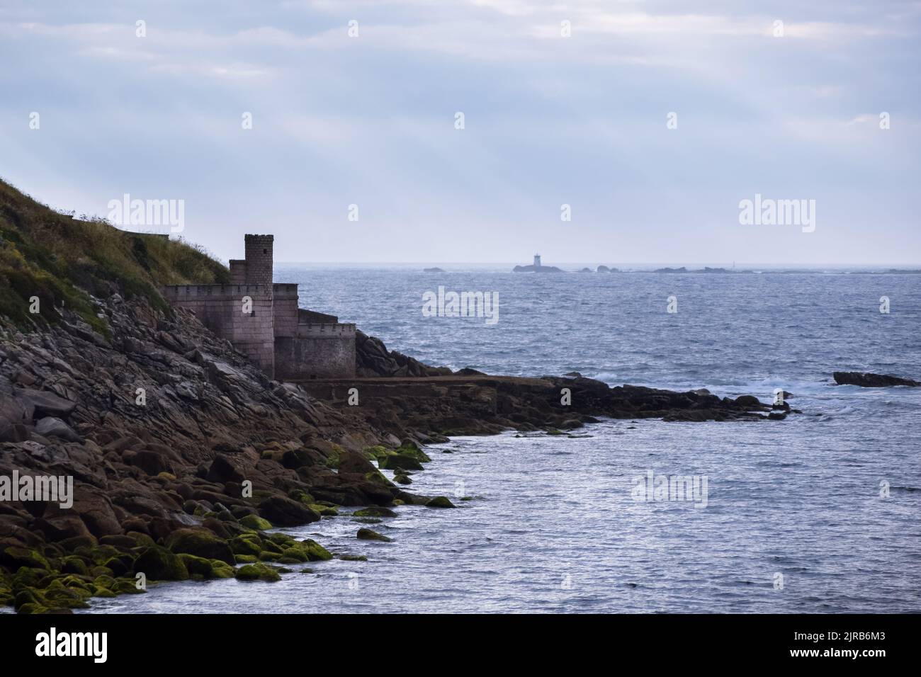 Small watchtower by the sea. Tower located on the promenade that surrounds the Parador and the Monterreal fortress. Baiona - Spain Stock Photo