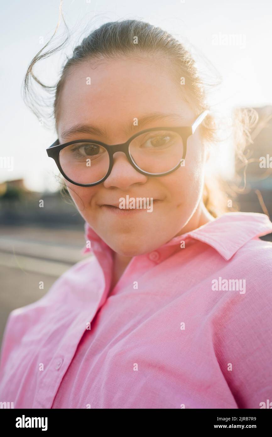 Teenage girl with down syndrome wearing eyeglasses Stock Photo Alamy