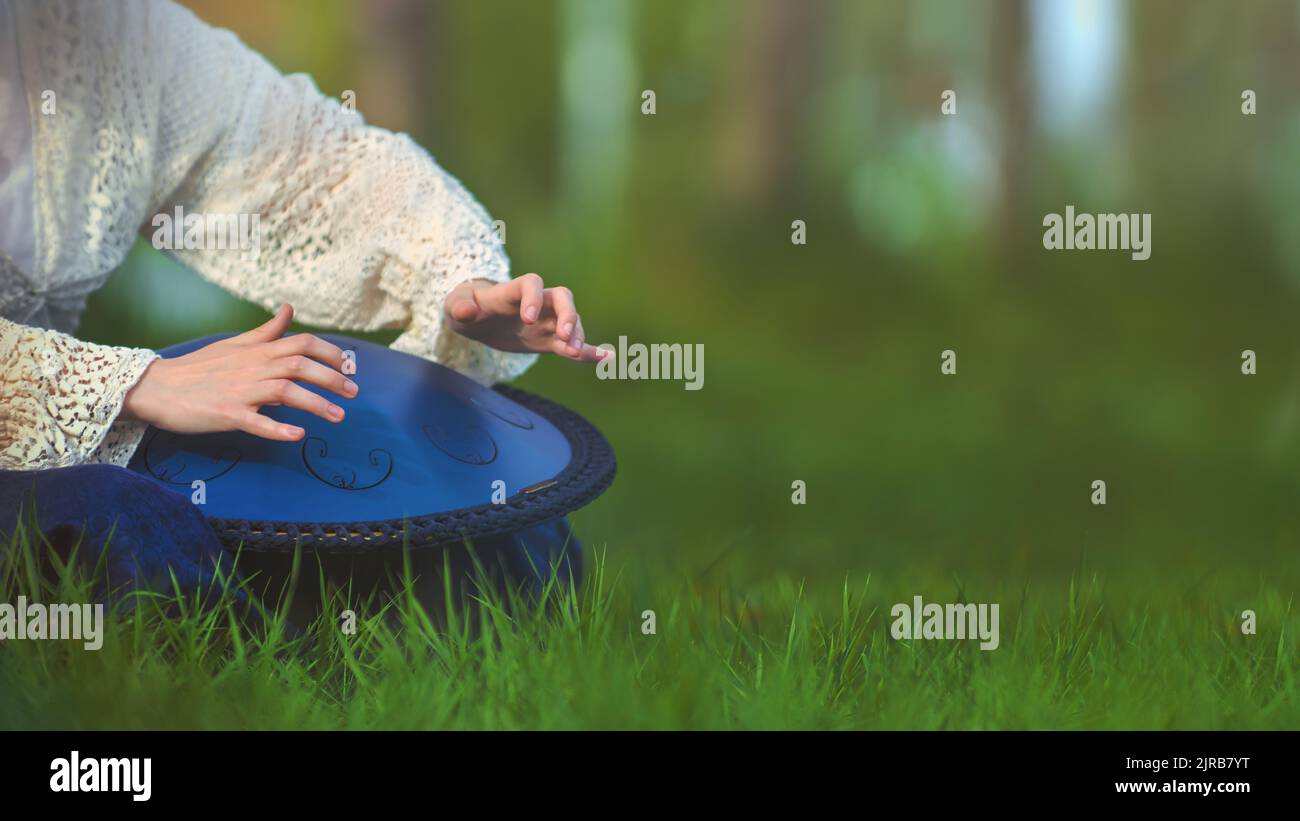 Tongue drum t is very similar to the musical instrument called a handpan, hang or pantam. Stock Photo