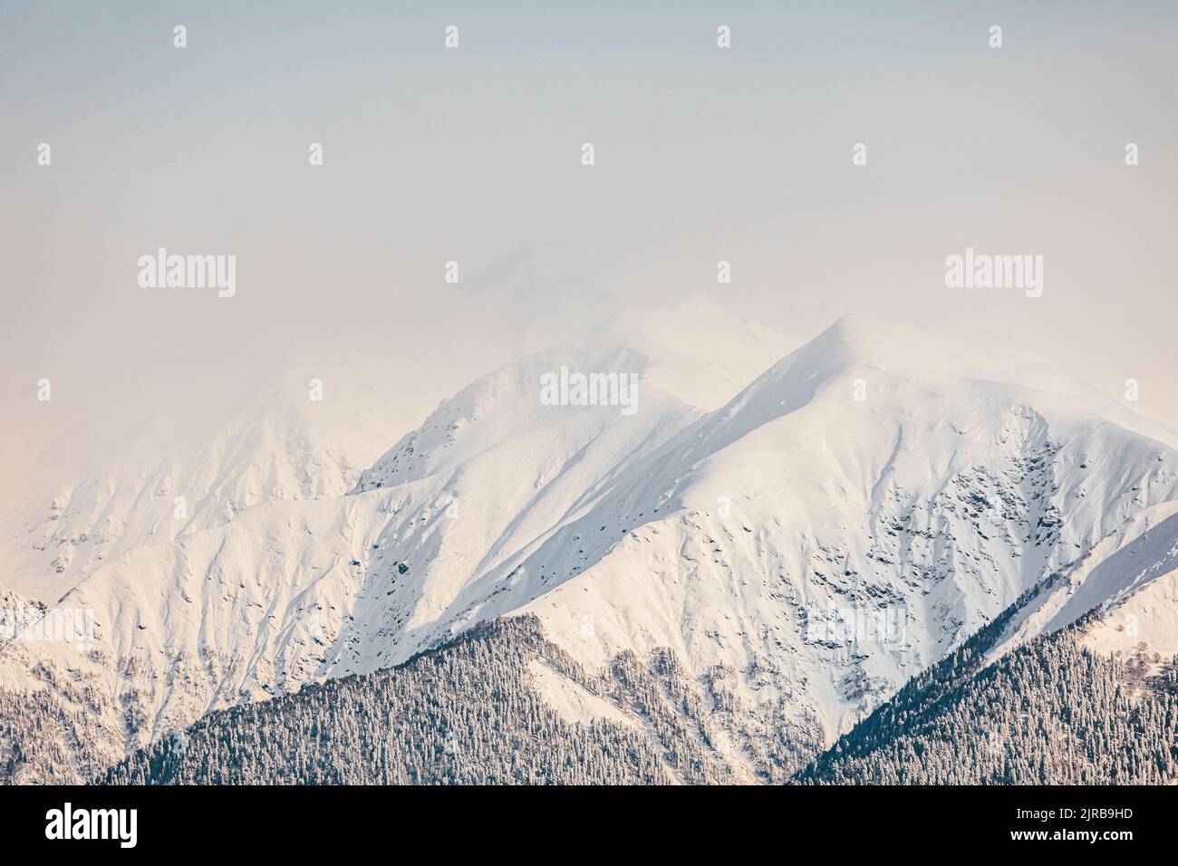 Scenic view of snowcapped mountains on sunny day Stock Photo