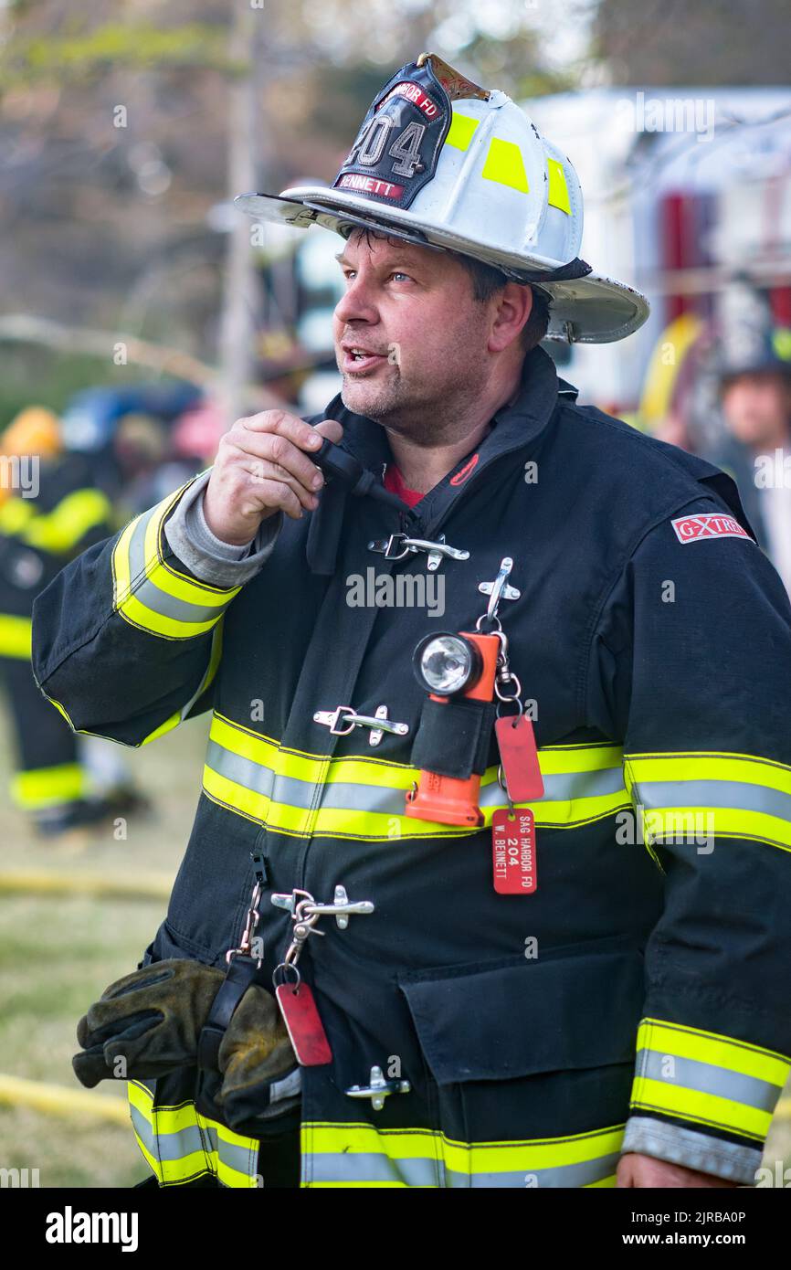 Sag Harbor Fire Department Chief Bill Bennett speaks on his radio. as the Sag Harbor Fire Department held a training drill on Monday, April 19th, 2010 Stock Photo