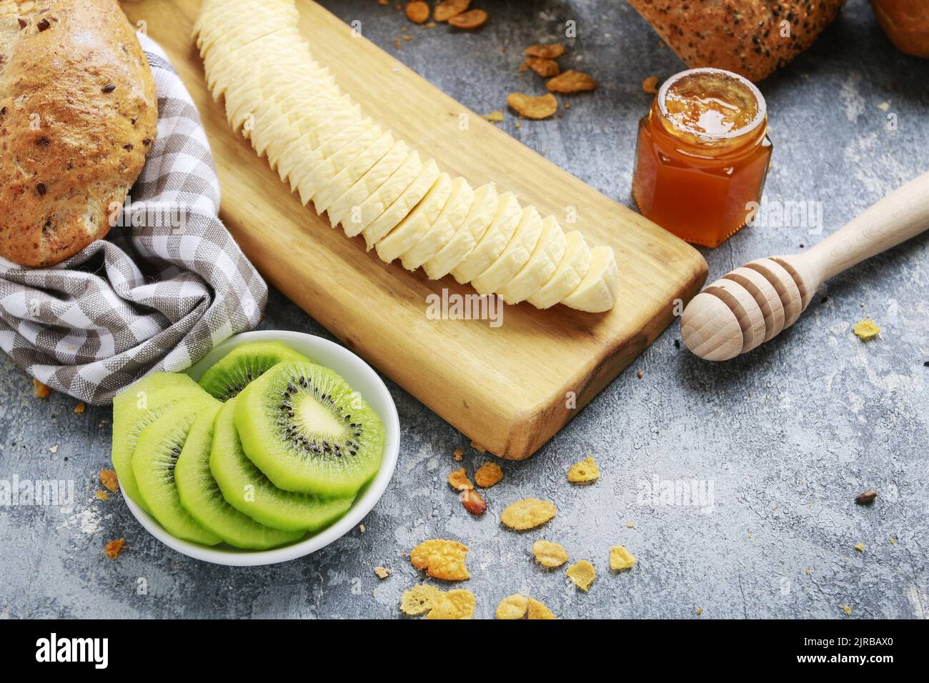 Healthy breakfast: fruits, buns and honey. Healthy food Stock Photo