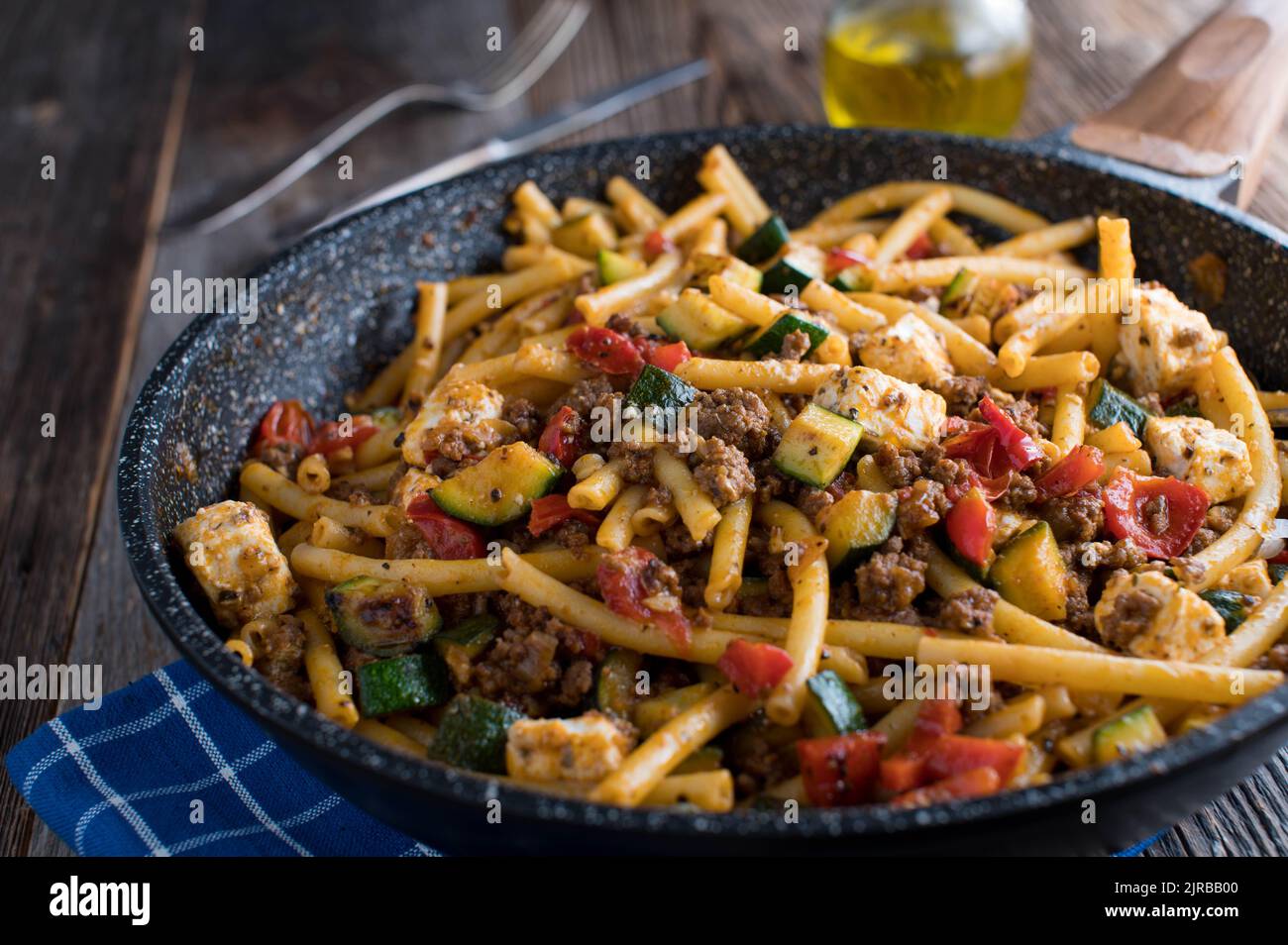One pan pasta dish with macaroni, ground beef, vegetables and feta