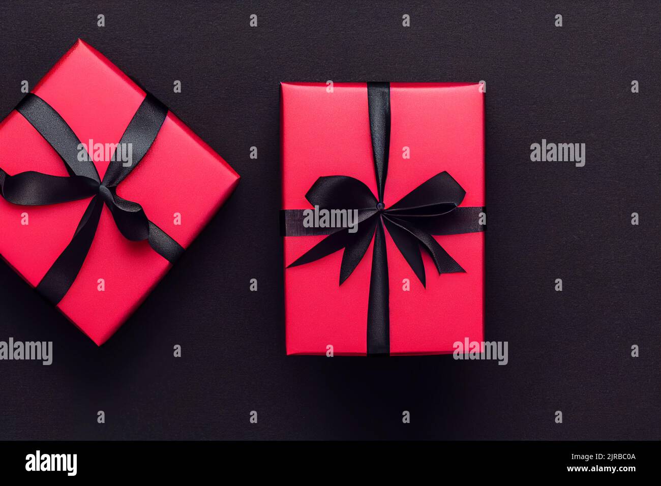 Gift box with gold coloured wrapping paper and a black ribbon and bow Stock  Photo - Alamy