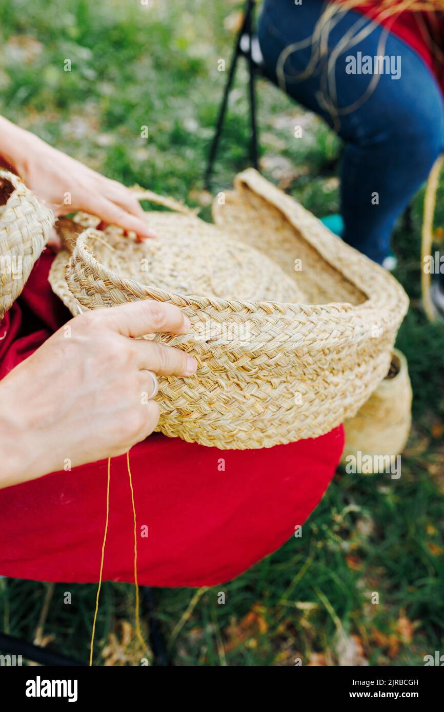 Hands of artisan making basket with esparto grass Stock Photo Alamy