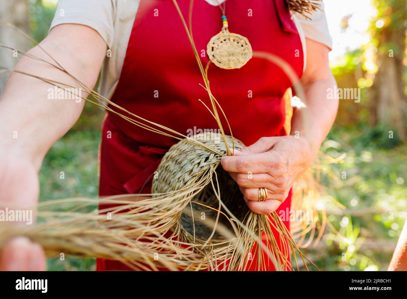 Hands of artisan weaving with esparto grass Stock Photo Alamy