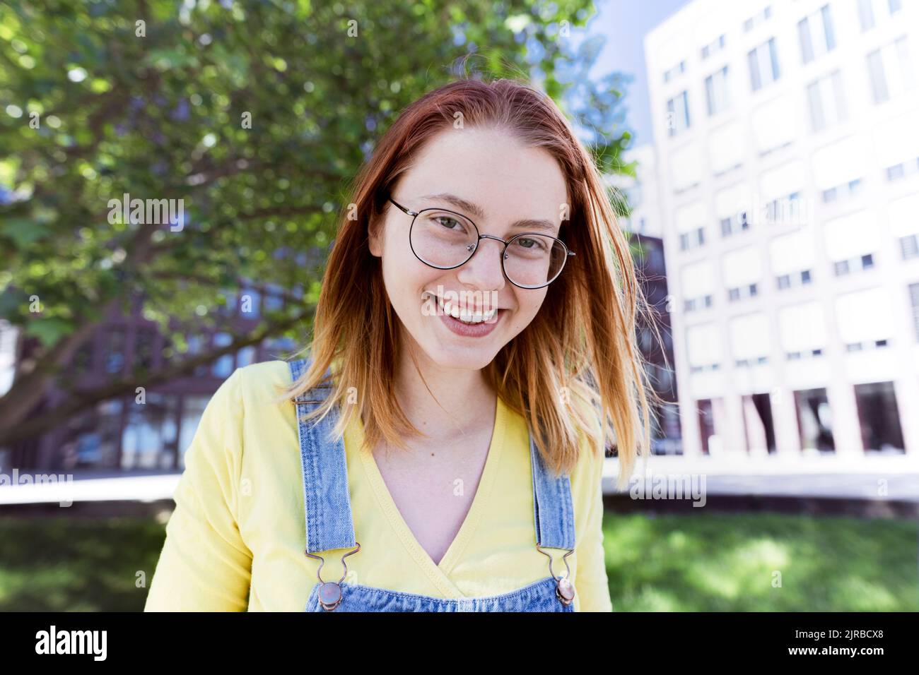 Portrait young redheaded woman wearing glasses hi-res stock photography ...